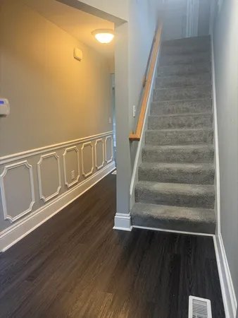a view of entryway with wooden floor