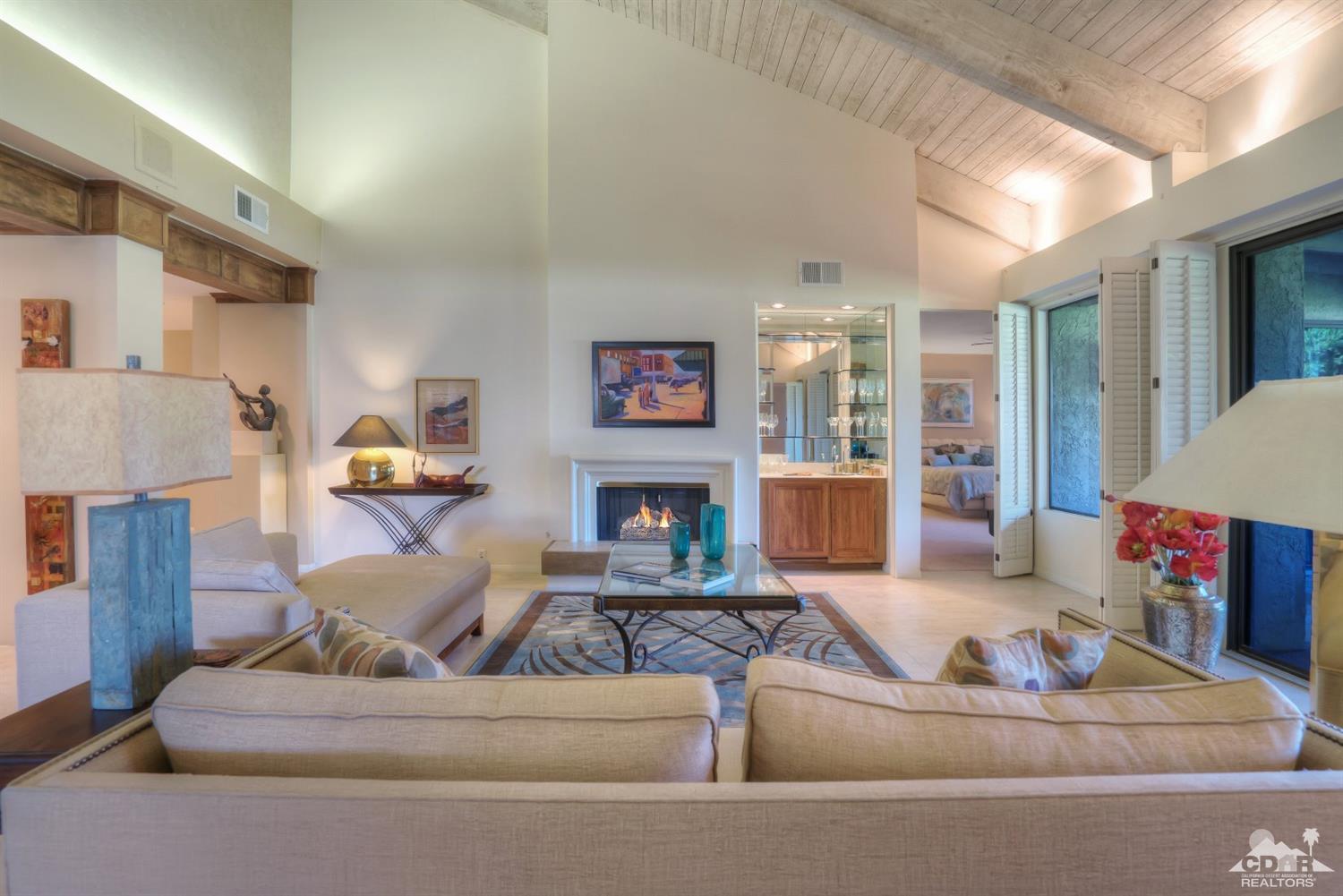 731 Inverness Drive Rancho Mirage, CA 92270 - Photo 8 of 34 a living room with furniture and a fireplace