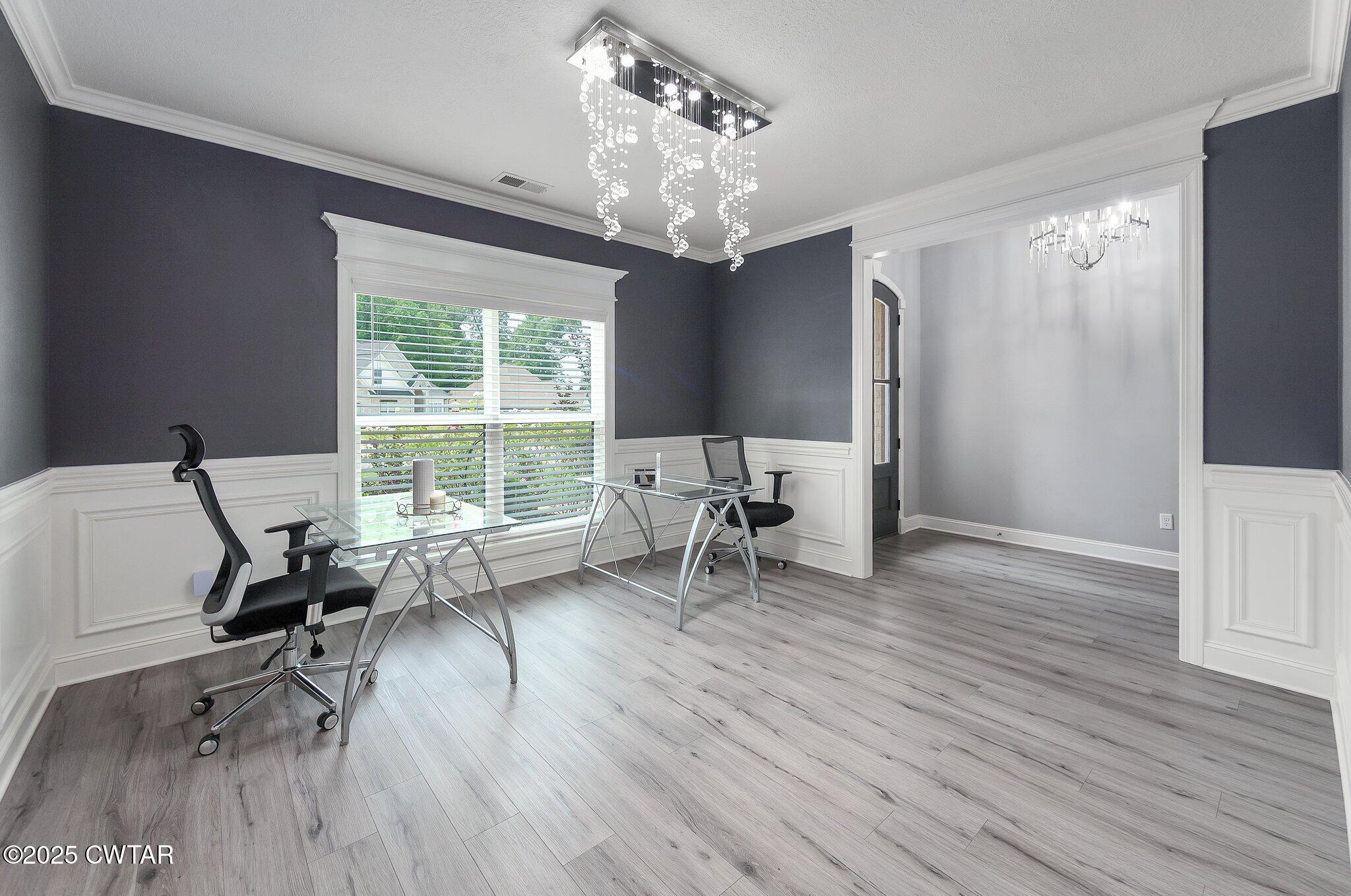 63 Westcott Cove Jackson, TN 38305 - Photo 12 of 31 a living room with furniture and a chandelier