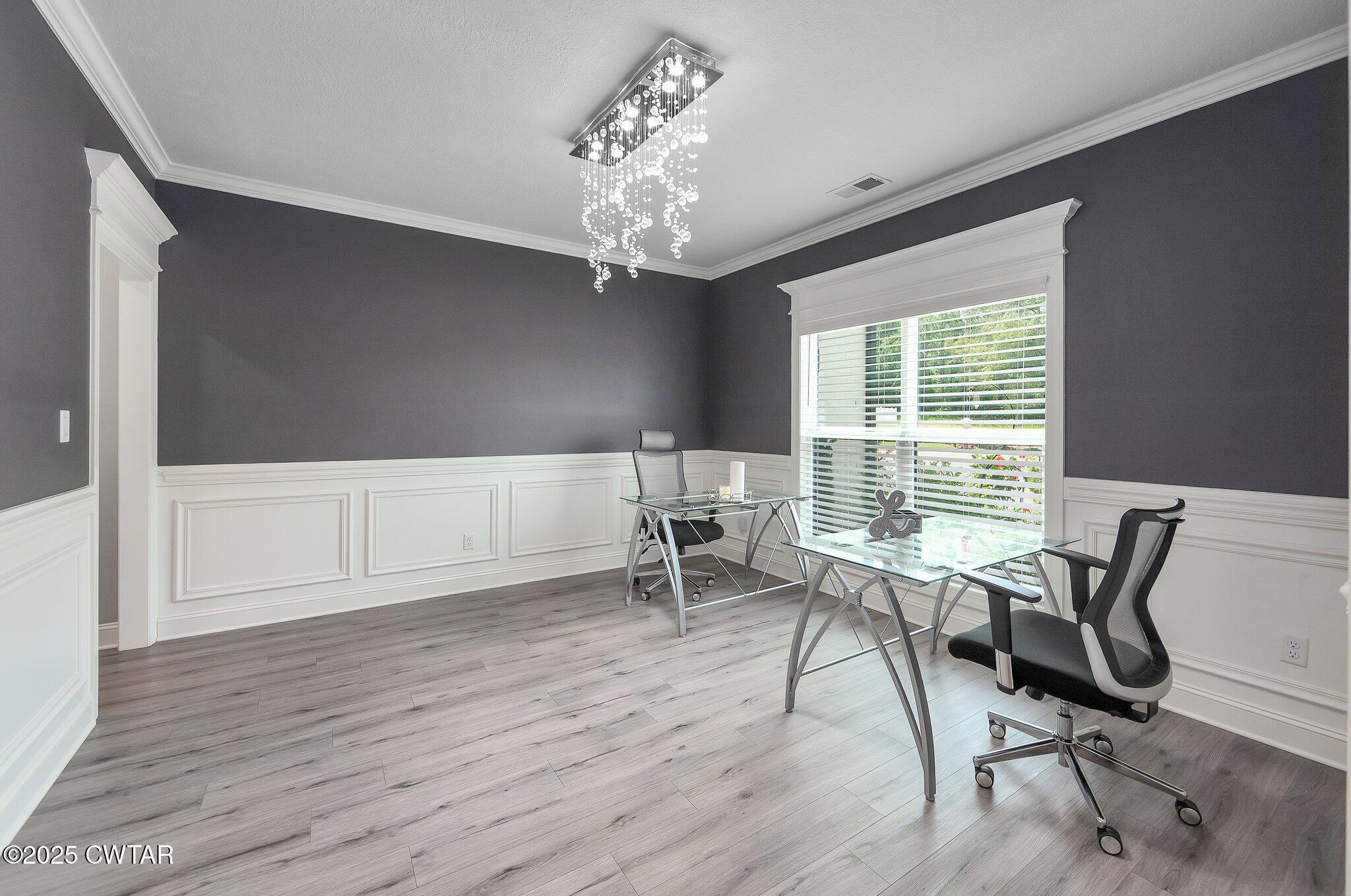 63 Westcott Cove Jackson, TN 38305 - Photo 13 of 31 a workspace with wooden floor and a window