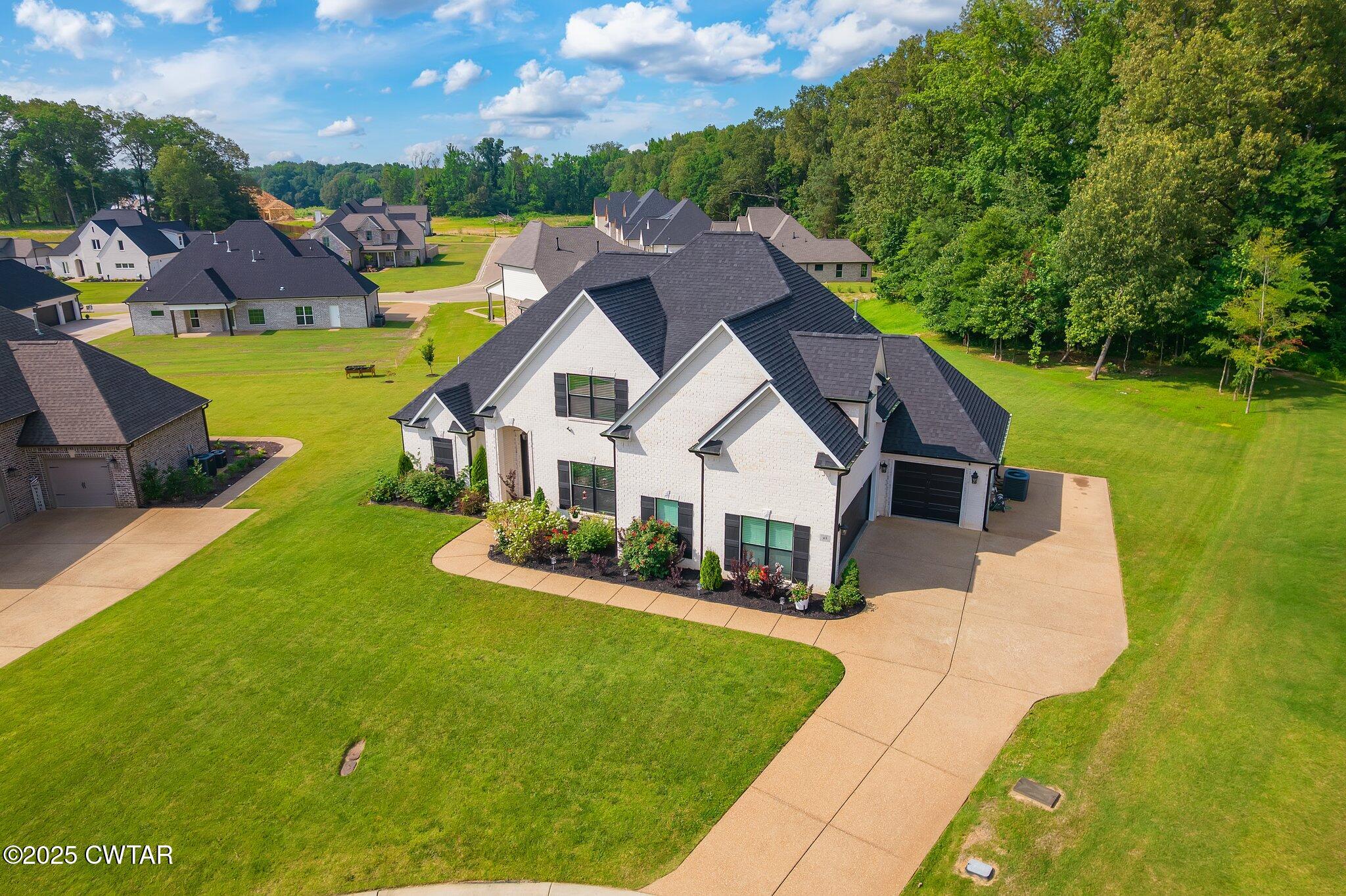 63 Westcott Cove Jackson, TN 38305 - Photo 2 of 31 a view of a house with a big yard