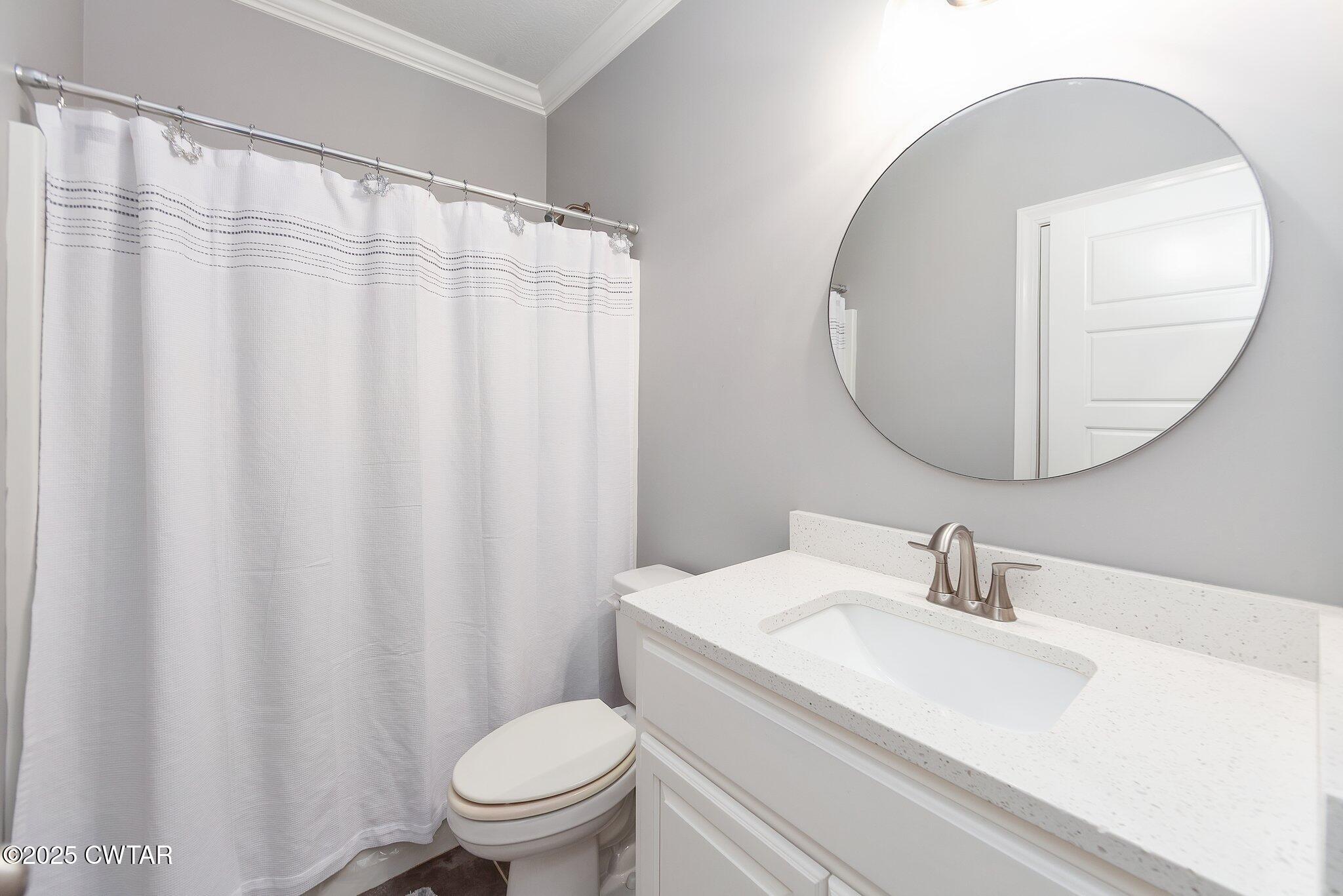 63 Westcott Cove Jackson, TN 38305 - Photo 21 of 31 a bathroom with a sink and a mirror