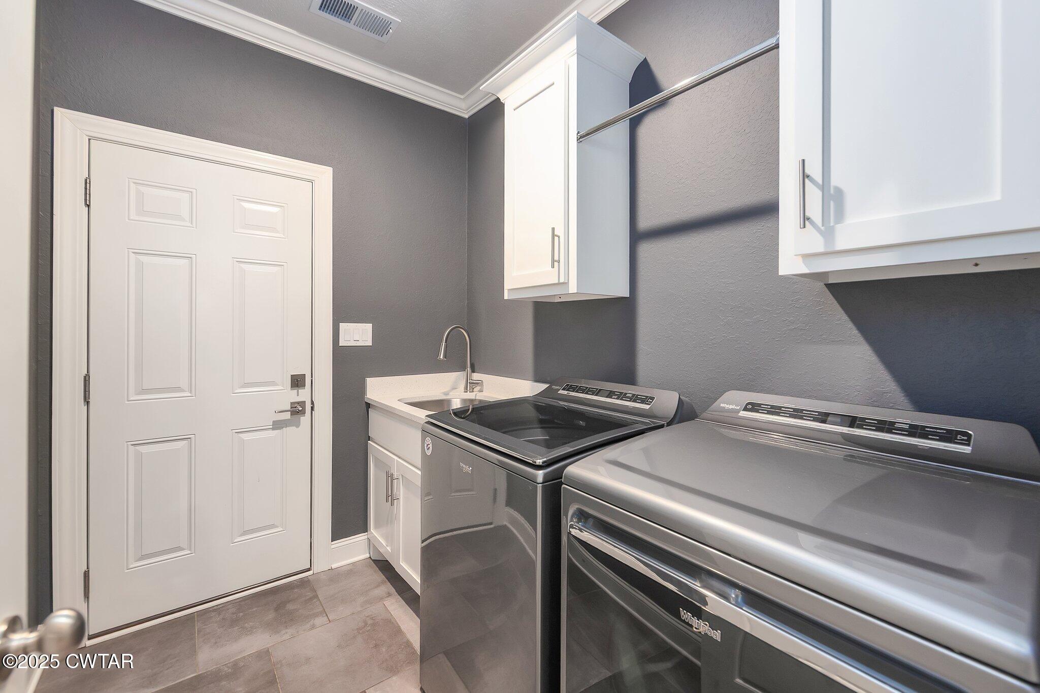 63 Westcott Cove Jackson, TN 38305 - Photo 26 of 31 a utility room with dryer and washer