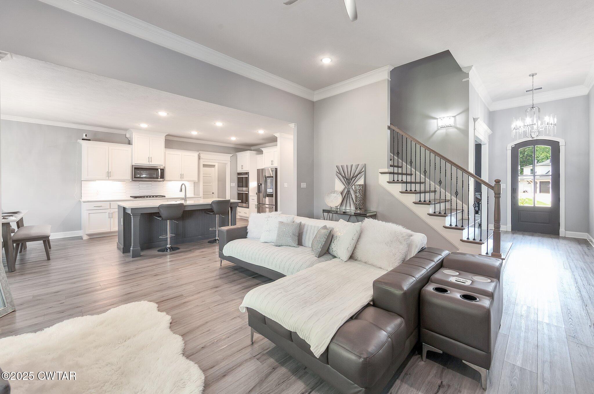63 Westcott Cove Jackson, TN 38305 - Photo 3 of 31 a living room with furniture and kitchen view