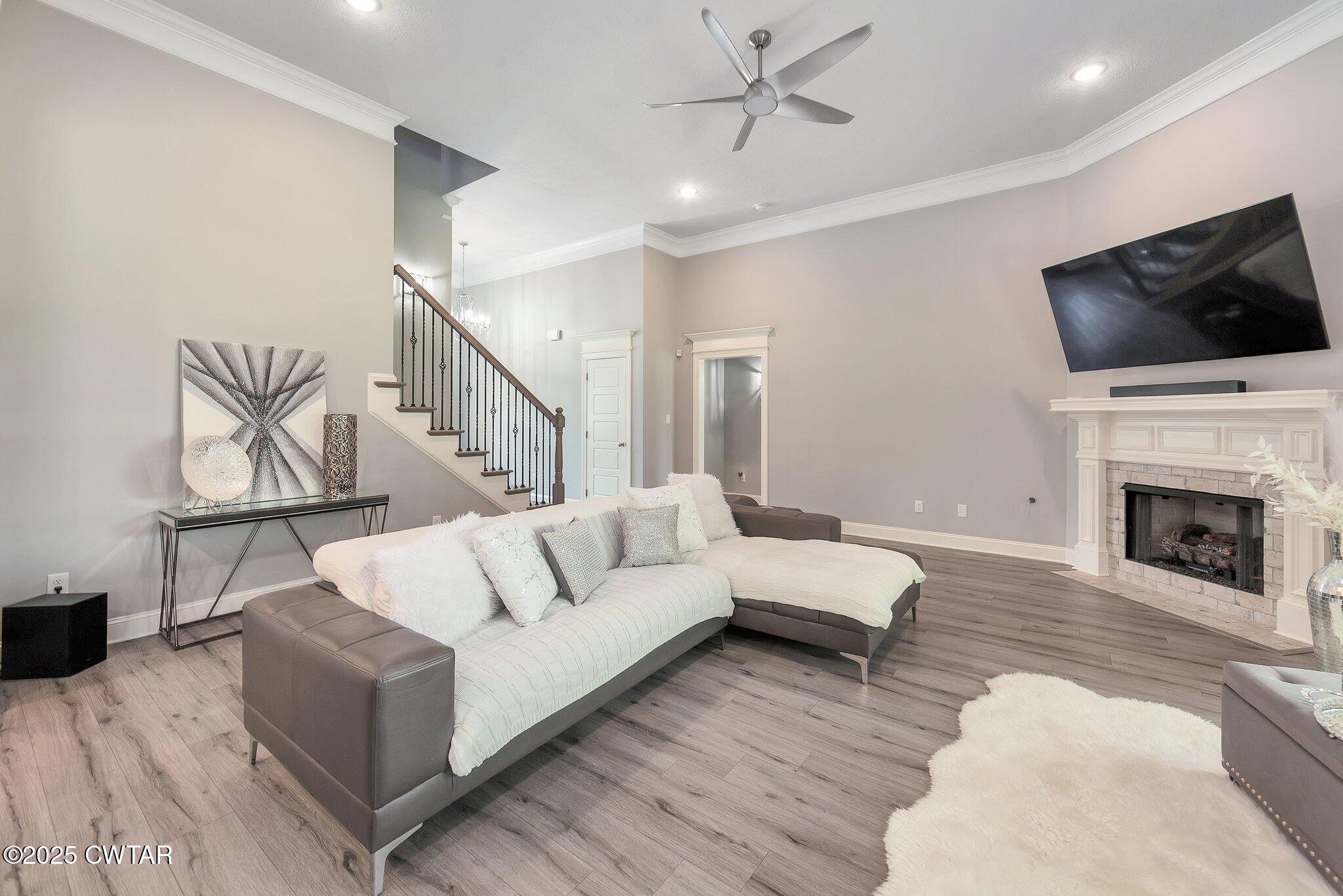 63 Westcott Cove Jackson, TN 38305 - Photo 4 of 31 a living room with furniture fireplace and flat screen tv