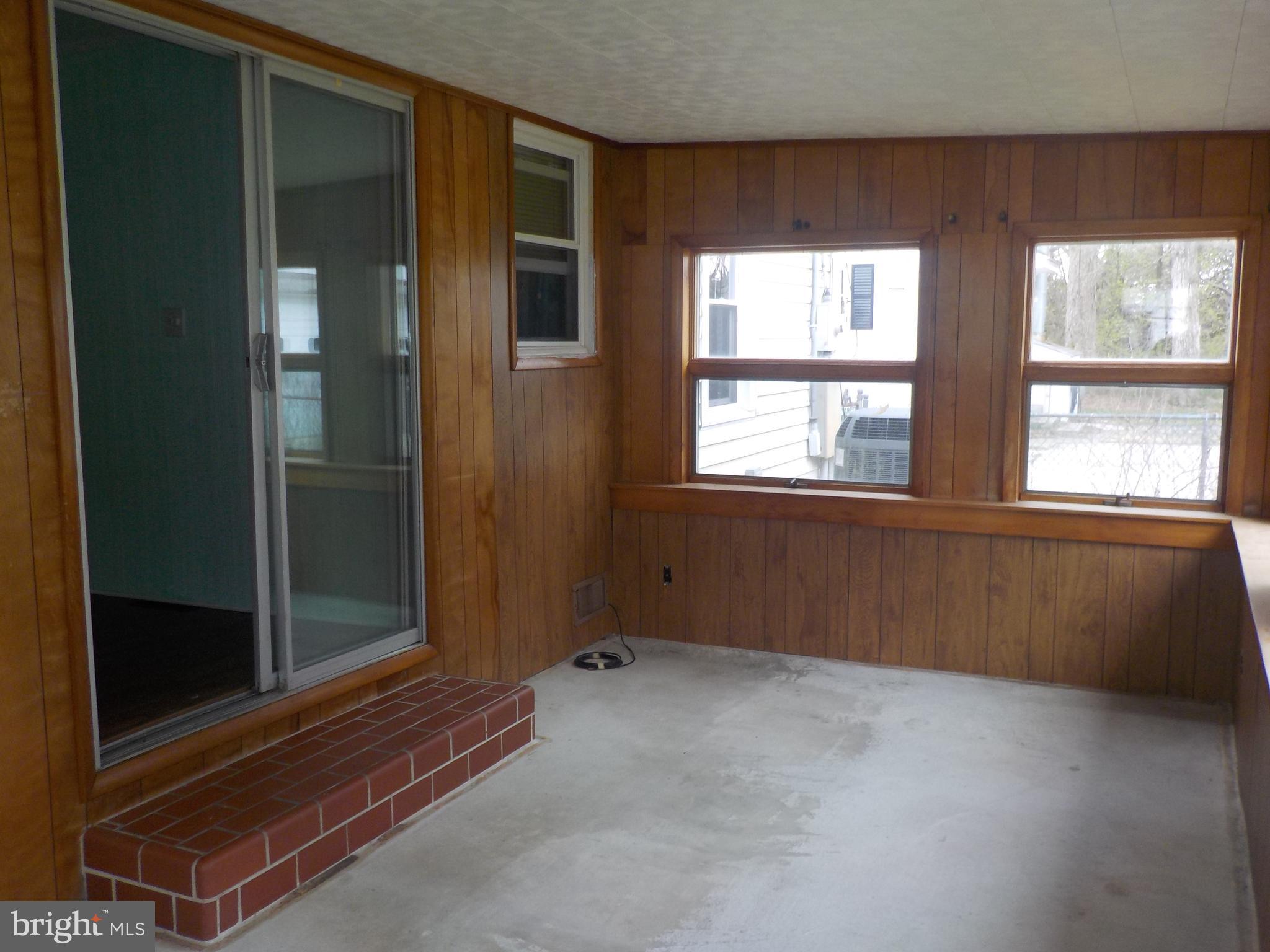 1419 Stone Boundary Road Cambridge, MD 21613 - Photo 18 of 21 Enclosed rear porch