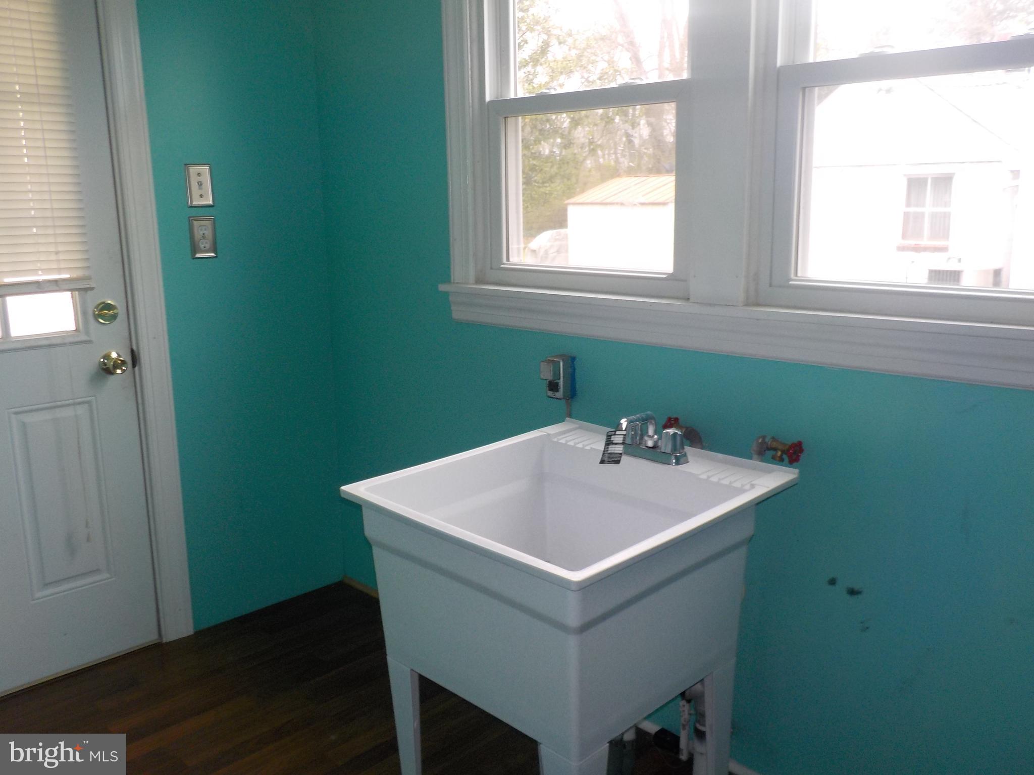 1419 Stone Boundary Road Cambridge, MD 21613 - Photo 8 of 21 Laundry room with sink
