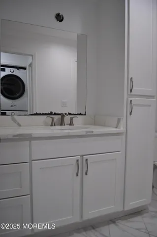 a bathroom with a sink a toilet and mirror