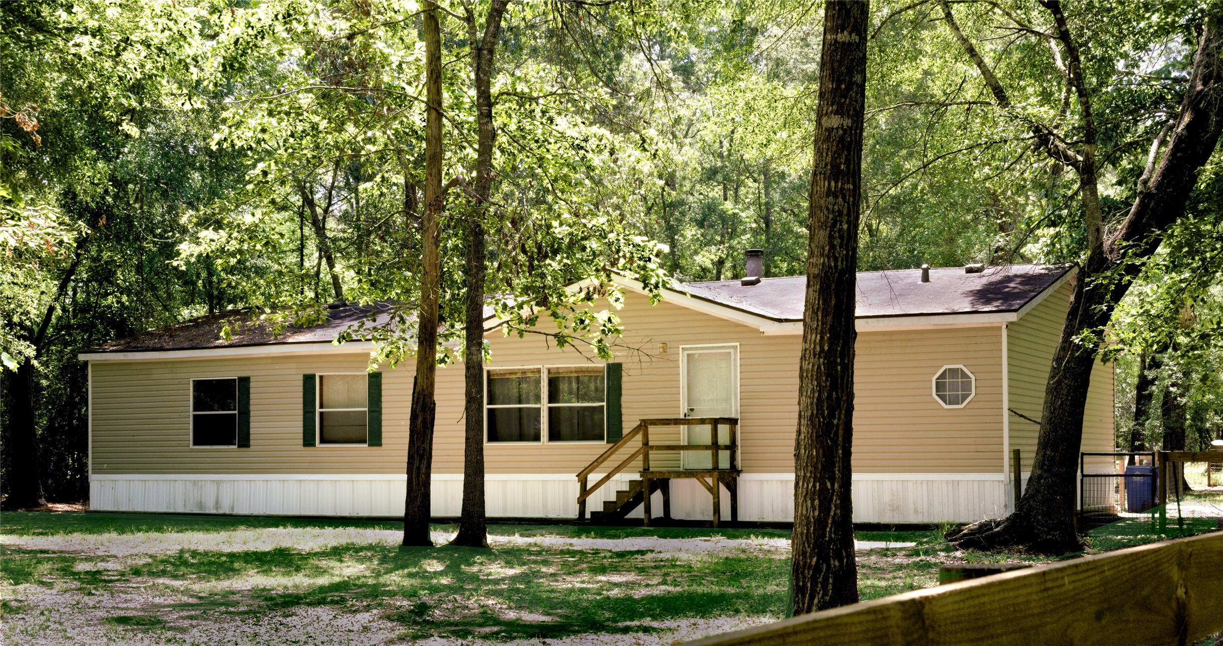 a view of house with backyard