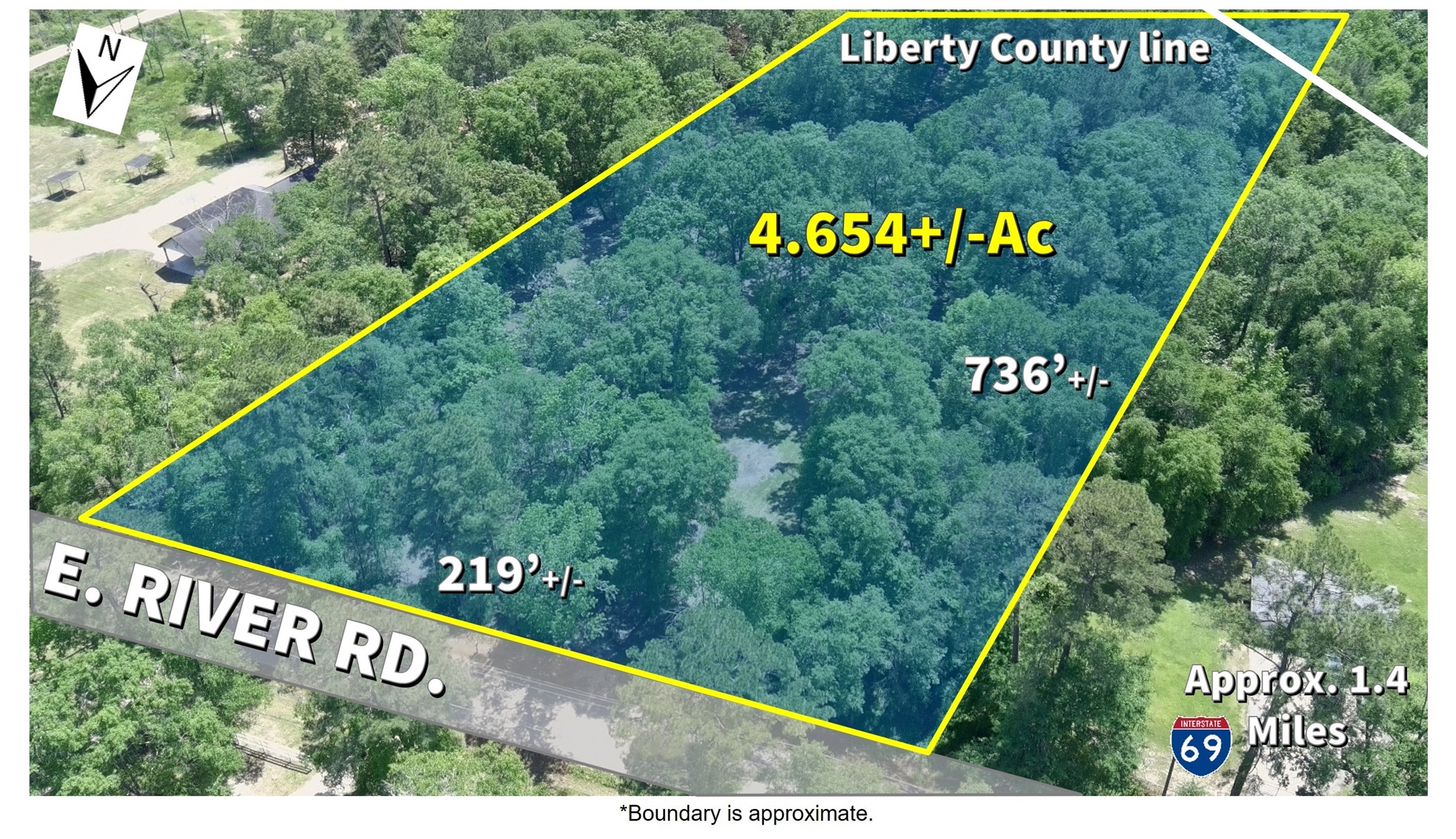 27894 East River Road Splendora, TX 77372 - Photo 3 of 12 a view of a sign on the side of the road