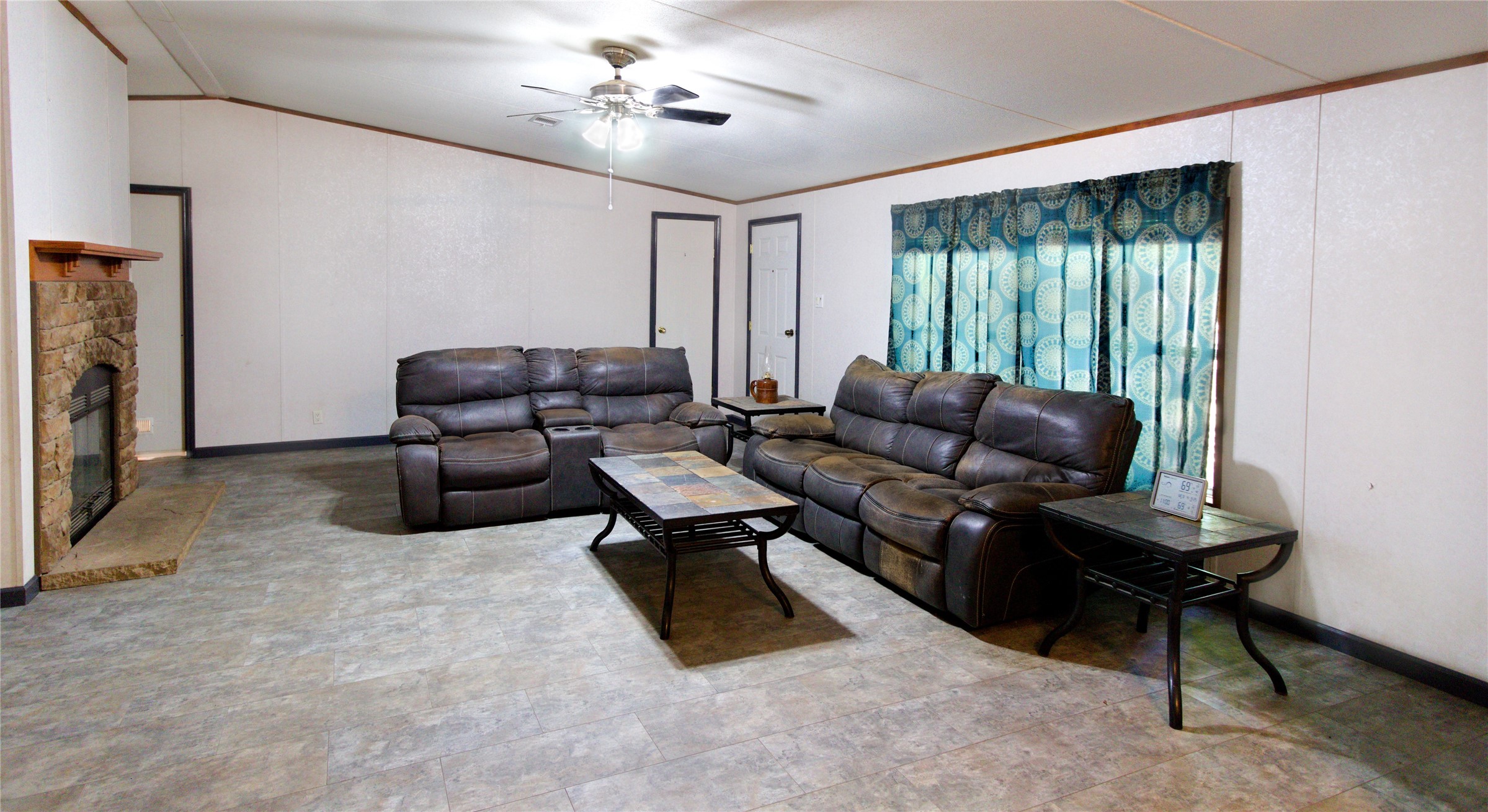 27894 East River Road Splendora, TX 77372 - Photo 6 of 12 a living room with furniture ceiling fan and a window