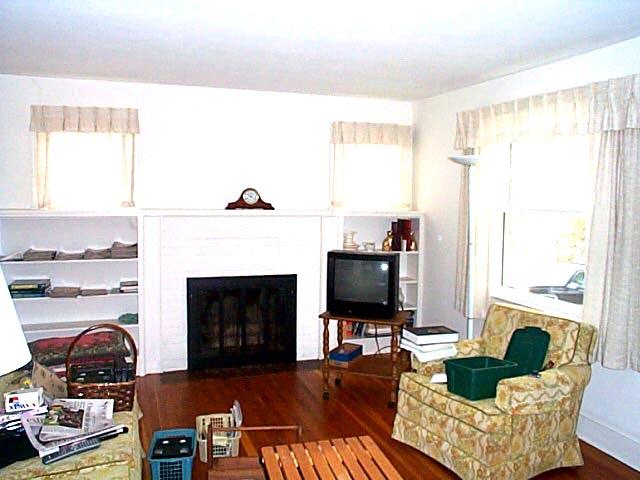 2532 Rutrough Road Southeast Roanoke, VA 24014 - Photo 6 of 9 a living room with furniture a fireplace and a flat screen tv