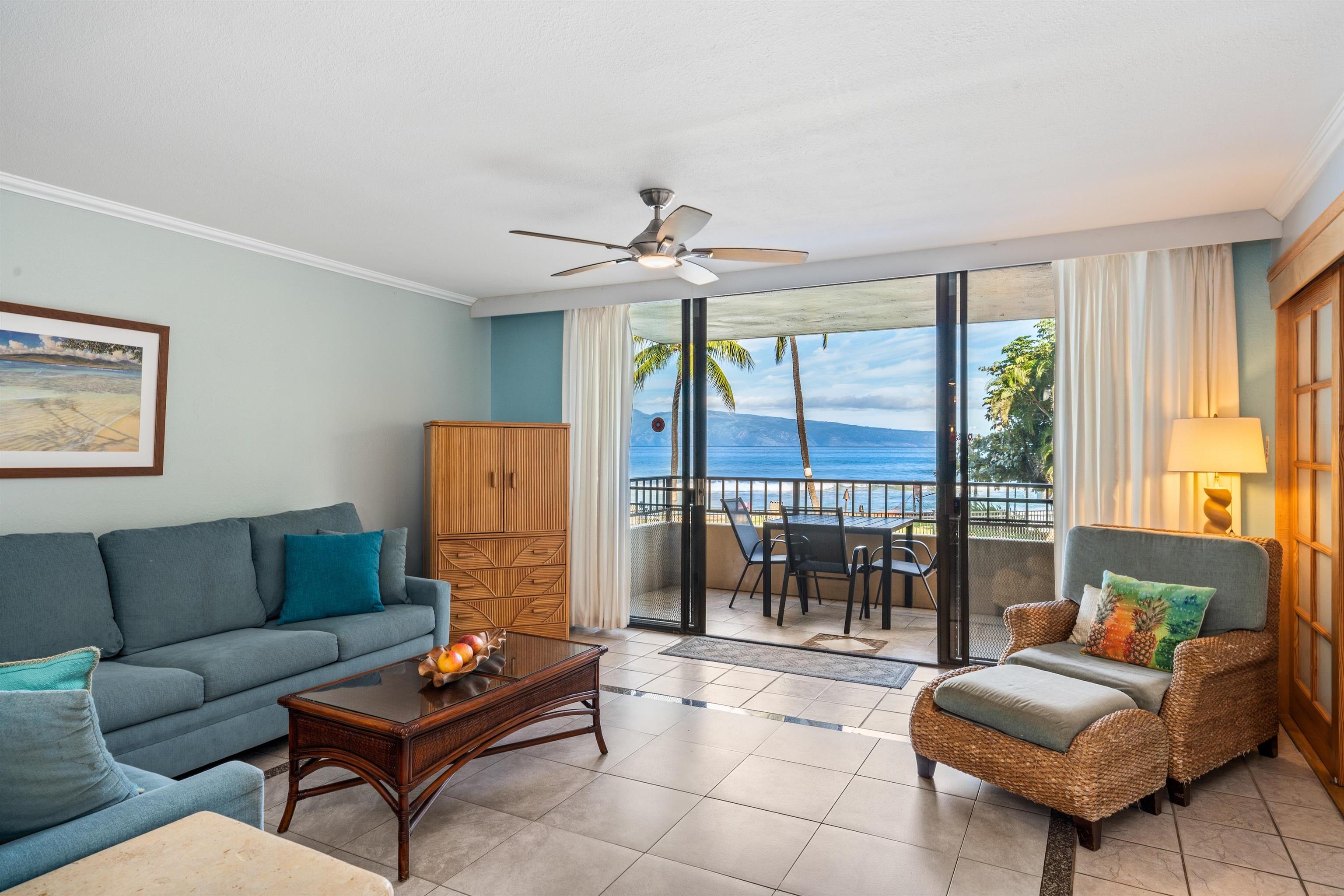 3615 Lower Honoapiilani Road, Unit 123 Lahaina, HI 96761 - Photo 1 of 41 a living room with furniture and a large window