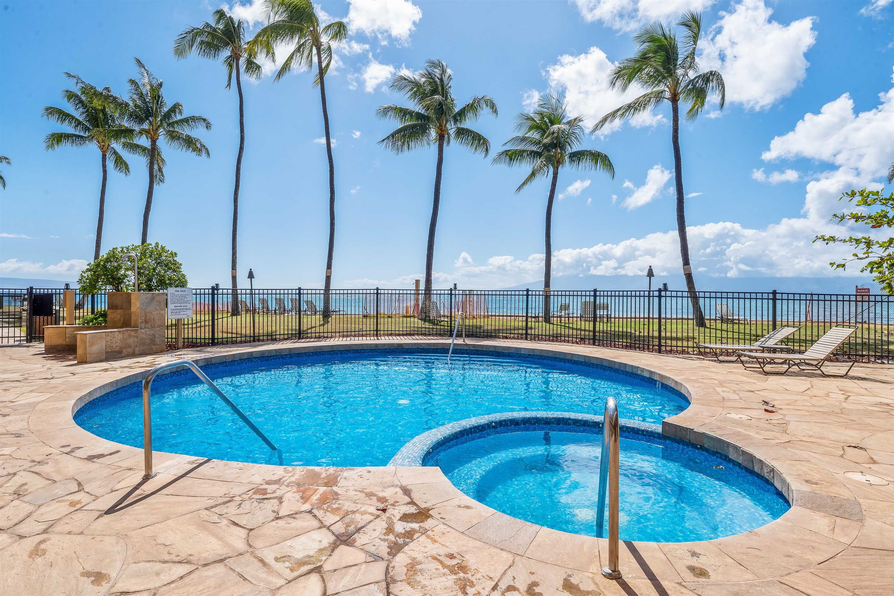 3615 Lower Honoapiilani Road, Unit 123 Lahaina, HI 96761 - Photo 11 of 41 a swimming pool with outdoor seating