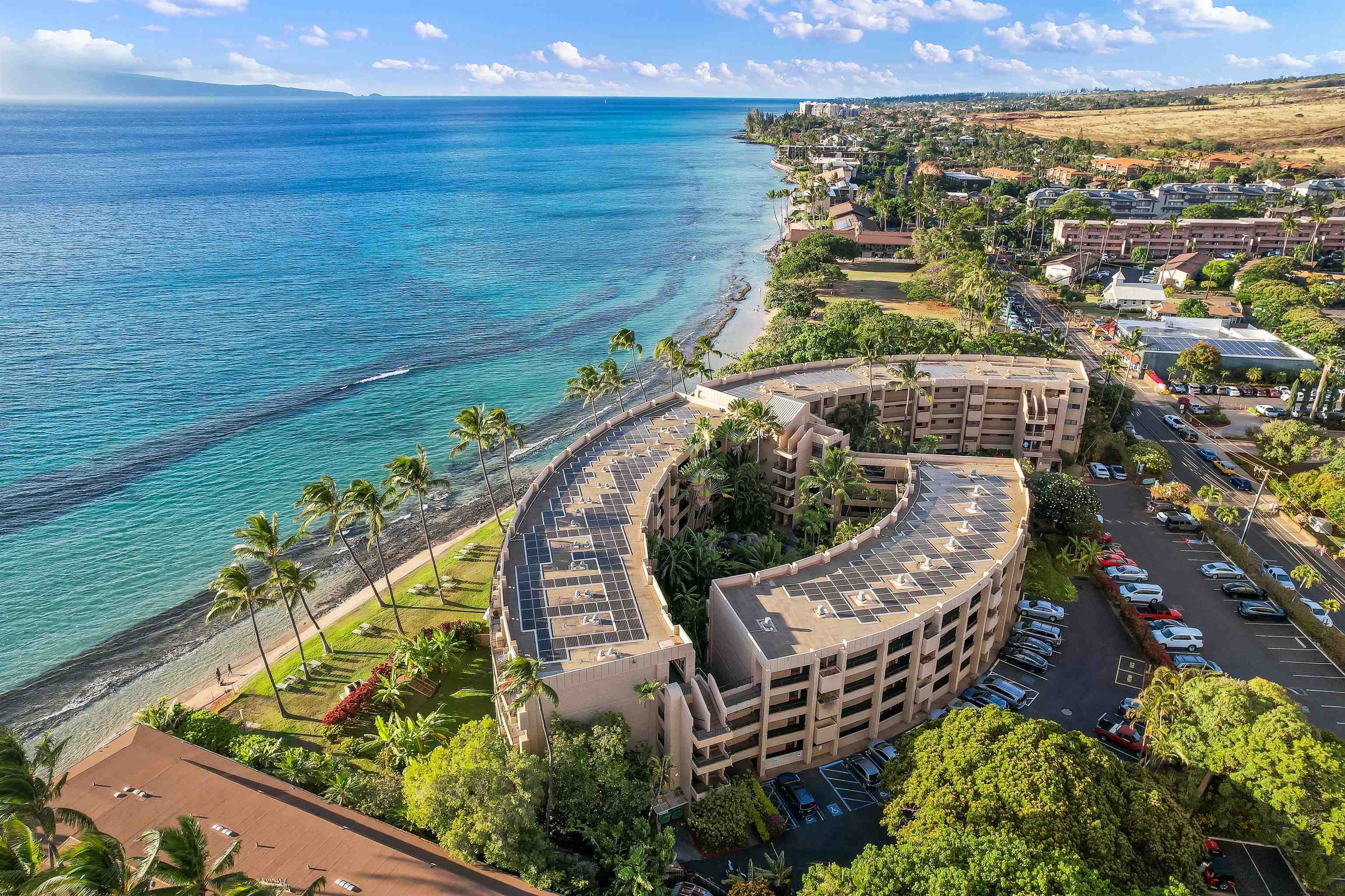 3615 Lower Honoapiilani Road, Unit 123 Lahaina, HI 96761 - Photo 14 of 41 a view of a swimming pool with a outdoor seating