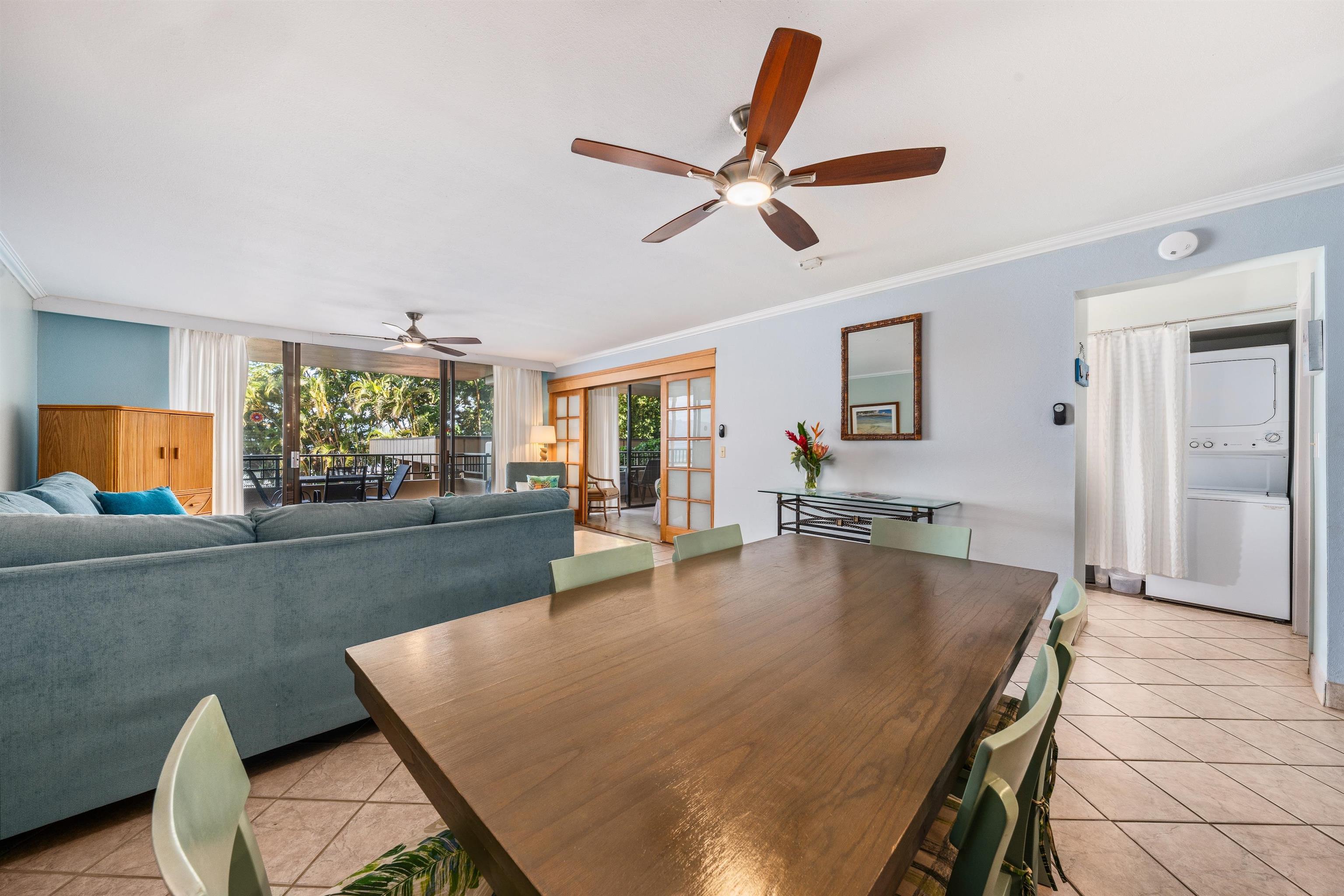3615 Lower Honoapiilani Road, Unit 123 Lahaina, HI 96761 - Photo 21 of 41 a living room with dining table furniture wooden floor and a window