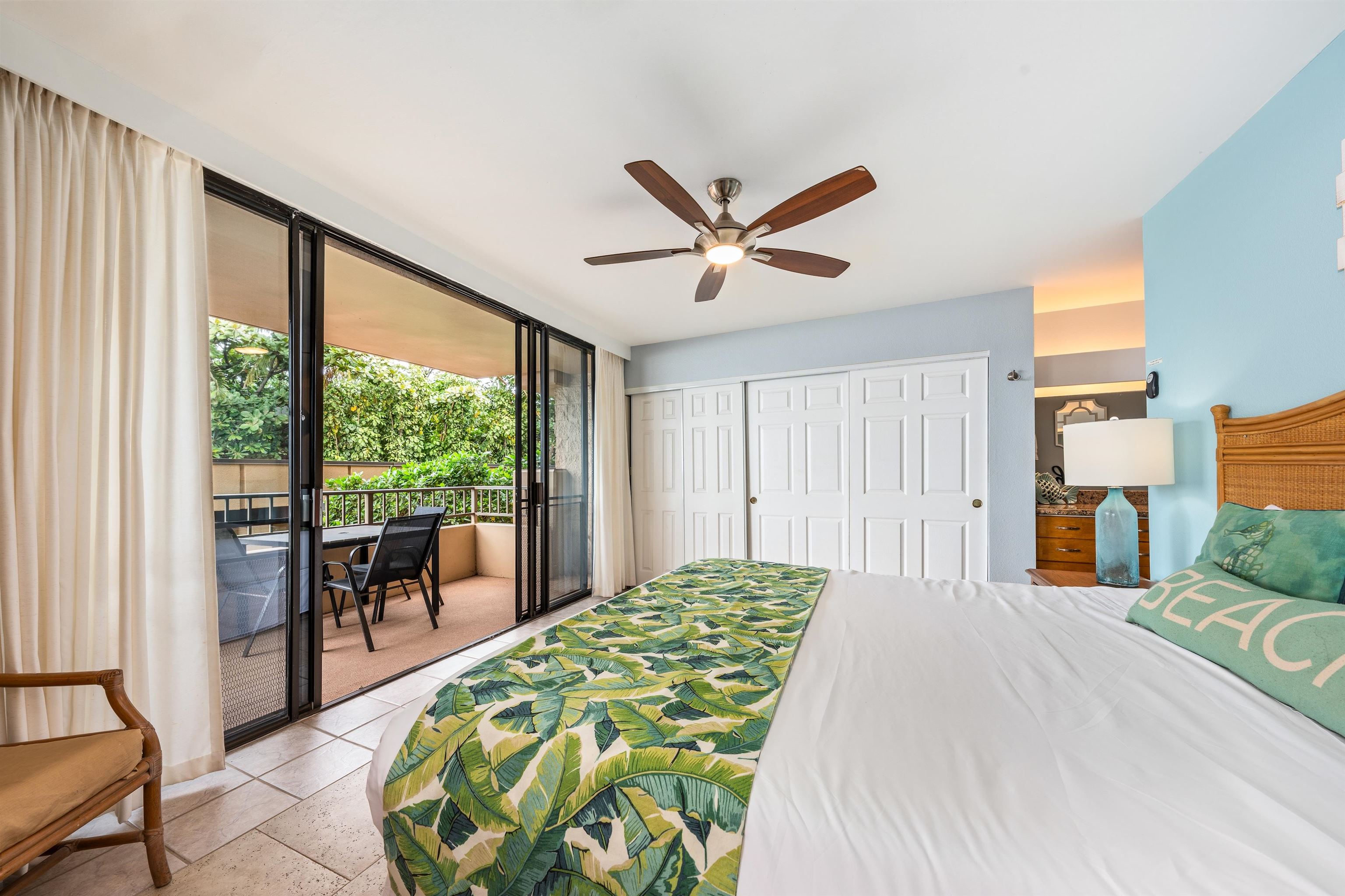 3615 Lower Honoapiilani Road, Unit 123 Lahaina, HI 96761 - Photo 31 of 41 a bedroom with a bed and a large window