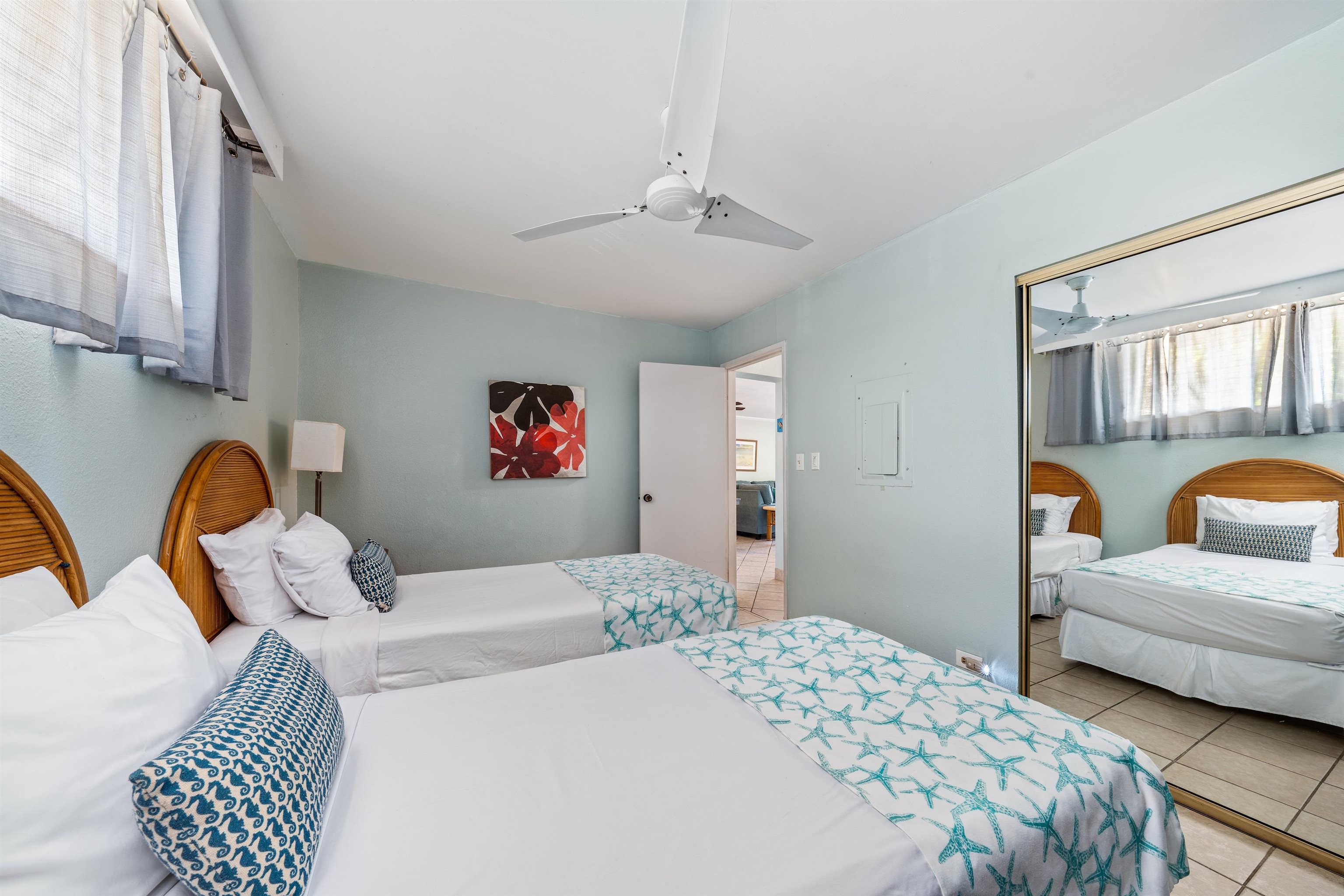 3615 Lower Honoapiilani Road, Unit 123 Lahaina, HI 96761 - Photo 35 of 41 a bedroom with a bed couch and window