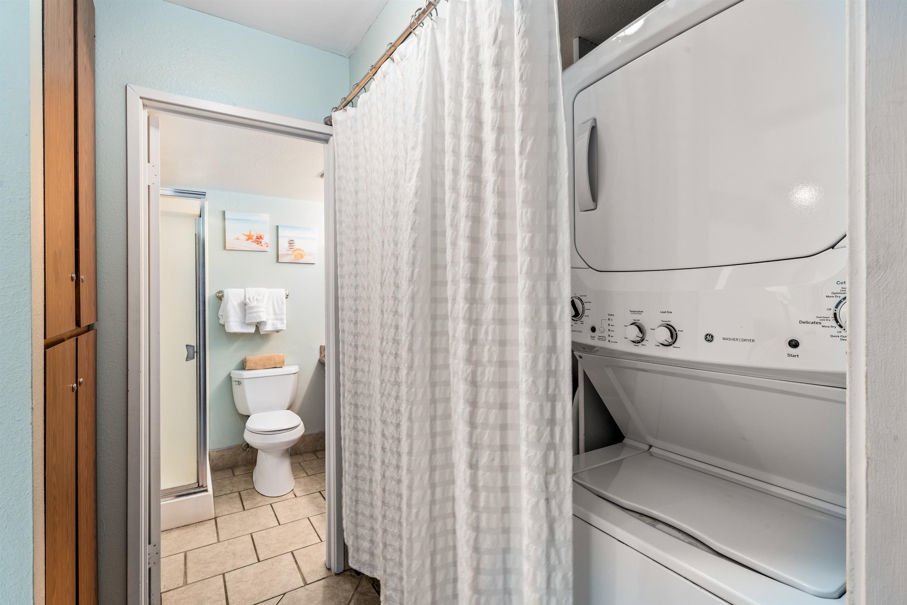 3615 Lower Honoapiilani Road, Unit 123 Lahaina, HI 96761 - Photo 37 of 41 a bathroom with a toilet and a shower curtain
