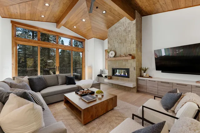 a living room with furniture fireplace and flat screen tv