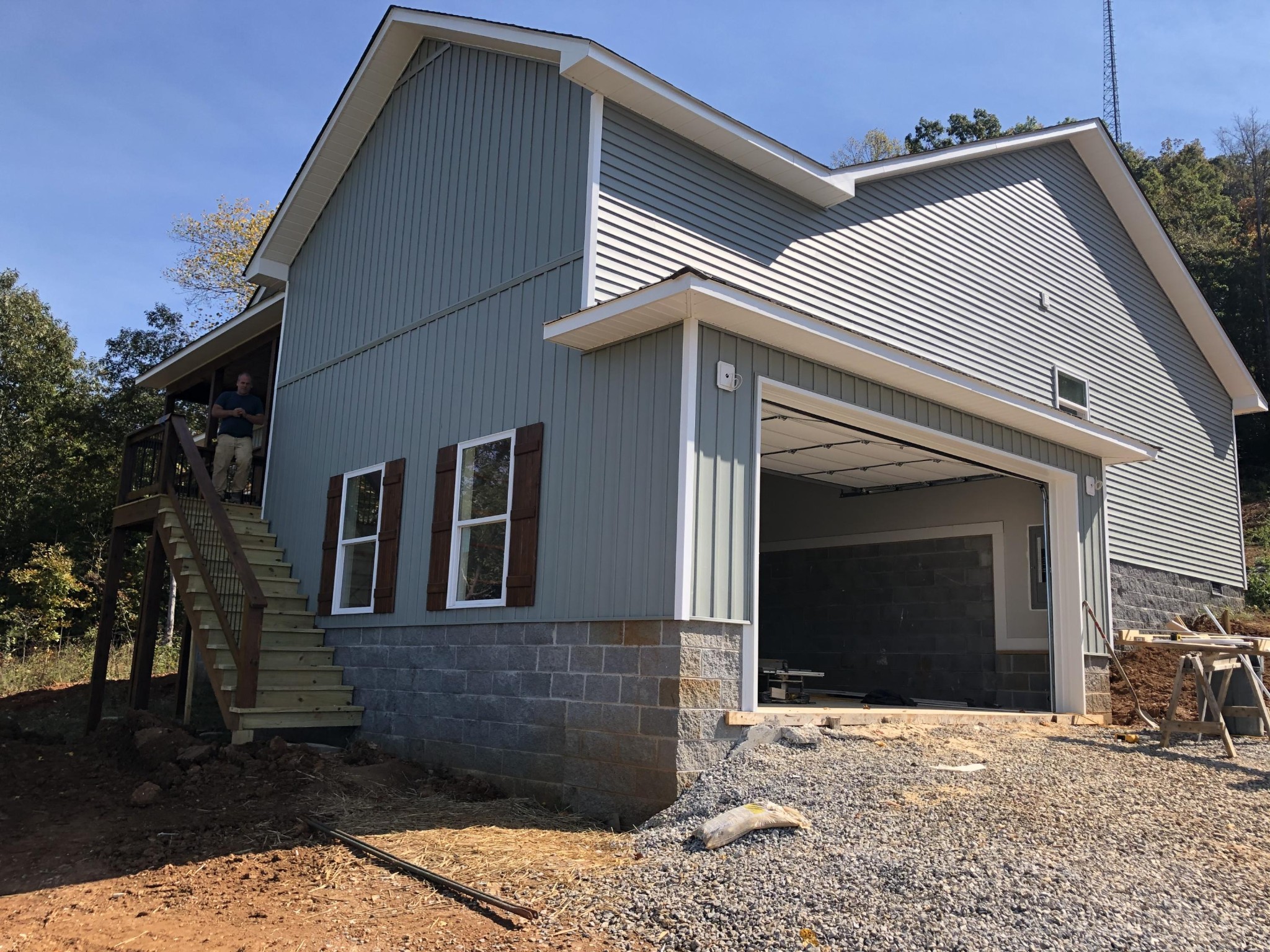 a view of house with outdoor space and parking space