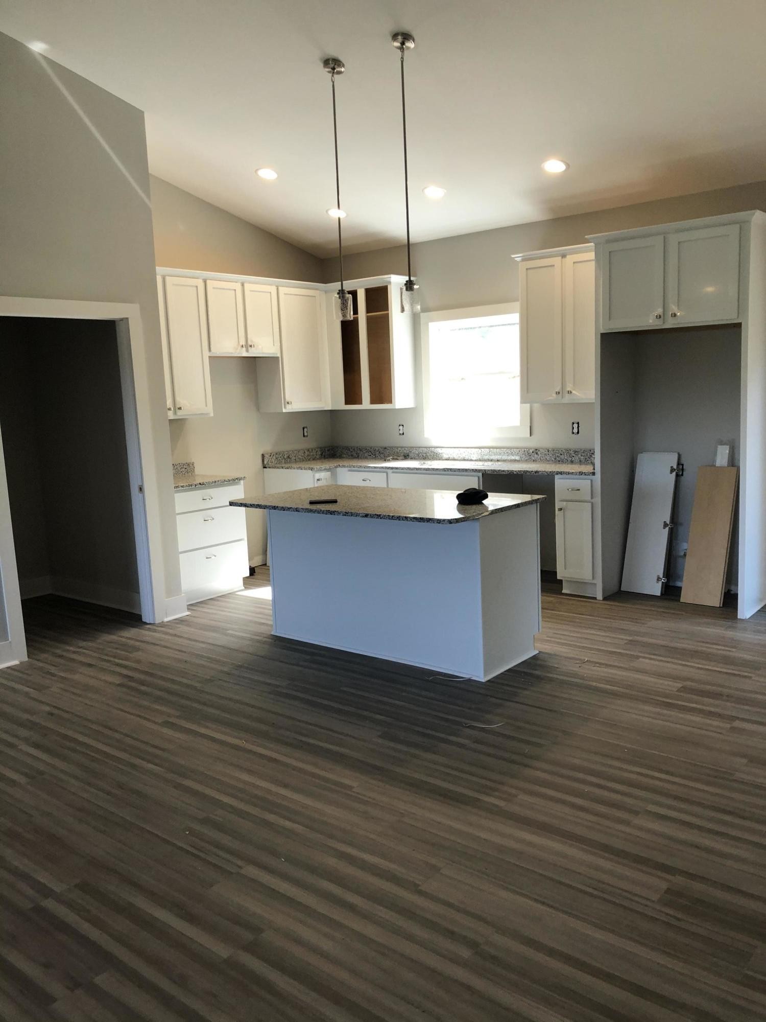 255 Clear Creek Road Kodak, TN 37764 - Photo 6 of 8 a large kitchen with stainless steel appliances granite countertop a stove a sink and a refrigerator