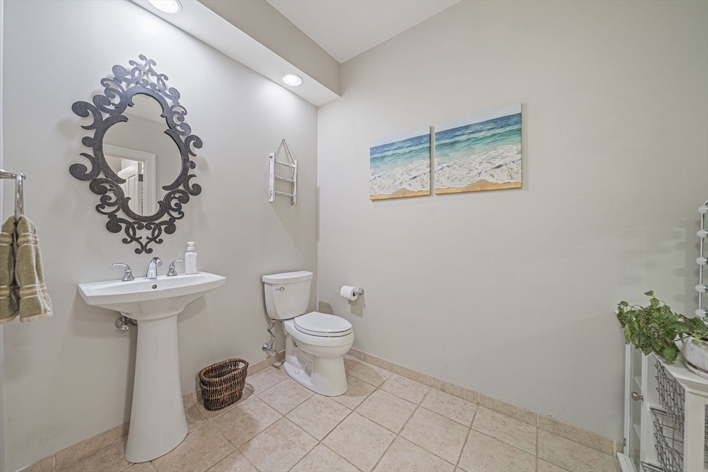 59 Walpole Street, Unit 115 Canton, MA 02021 - Photo 20 of 41 a bathroom with a toilet sink and mirror