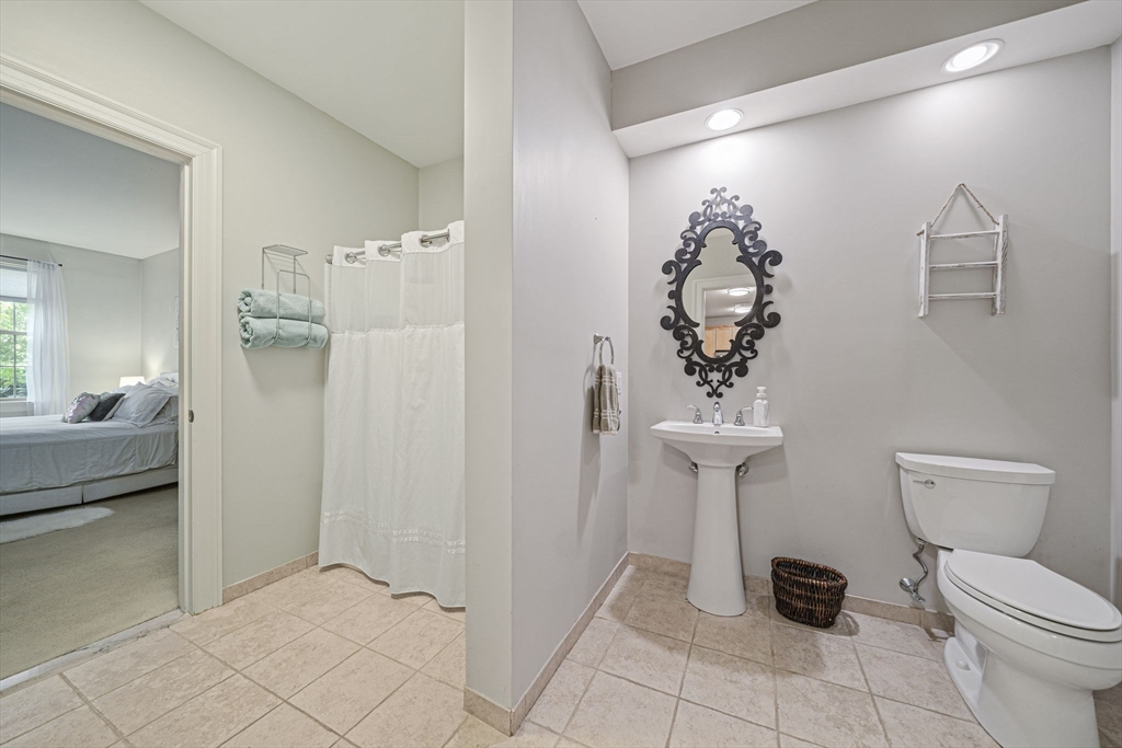 59 Walpole Street, Unit 115 Canton, MA 02021 - Photo 21 of 41 a bathroom with a toilet sink and shower