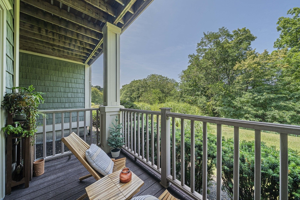 59 Walpole Street, Unit 115 Canton, MA 02021 - Photo 22 of 41 a view of balcony with wooden floor and outdoor seating