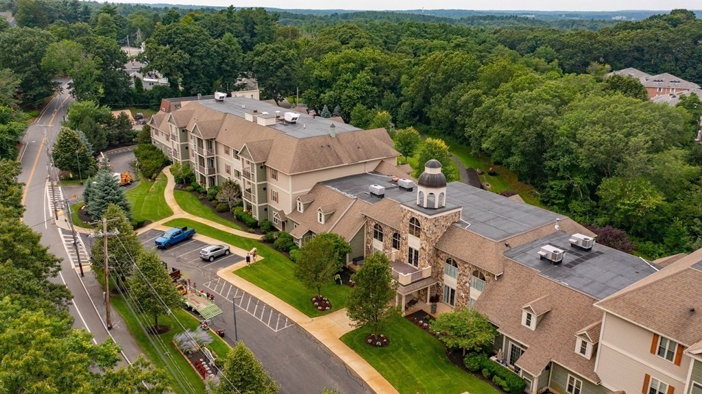 59 Walpole Street, Unit 115 Canton, MA 02021 - Photo 37 of 41 an aerial view of multiple houses with yard
