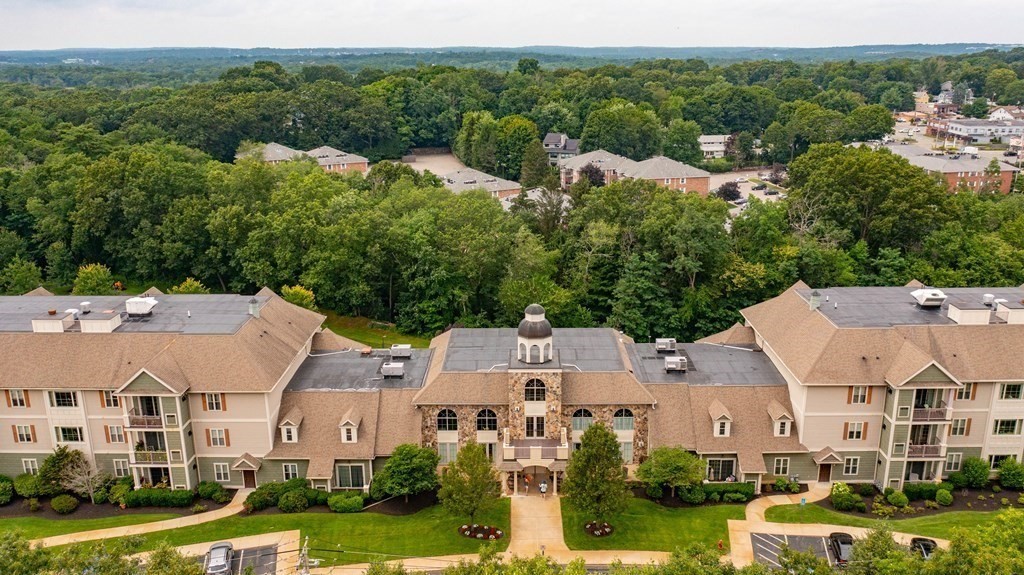59 Walpole Street, Unit 115 Canton, MA 02021 - Photo 39 of 41 an aerial view of residential houses with outdoor space and trees