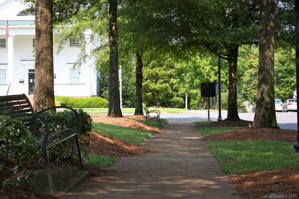 615 Caspar Way Fort Mill, SC 29708 - Photo 14 of 19 a view of a backyard with table and chairs and a large tree