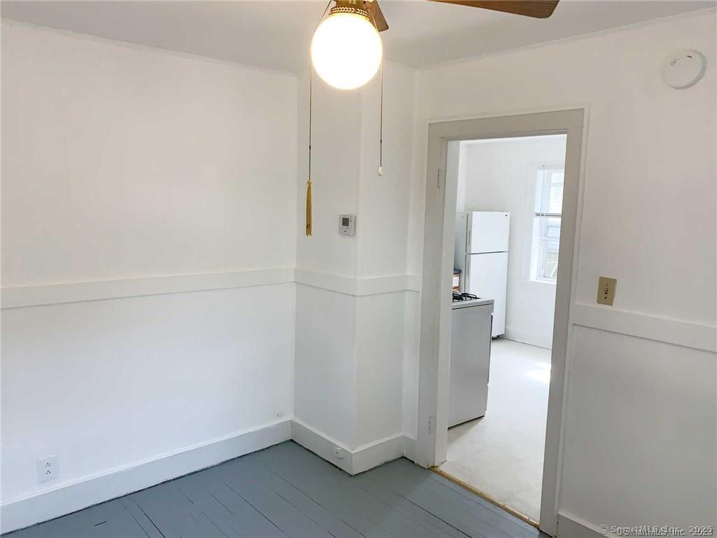 44 Brookside Avenue, Unit U2 Torrington, CT 06790 - Photo 9 of 10 wooden floor in an empty room and a bathroom
