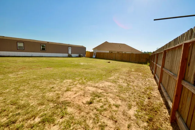 a view of a back yard of the house