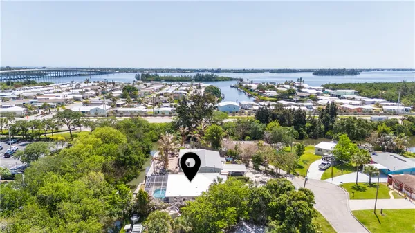 an aerial view of a house with a yard