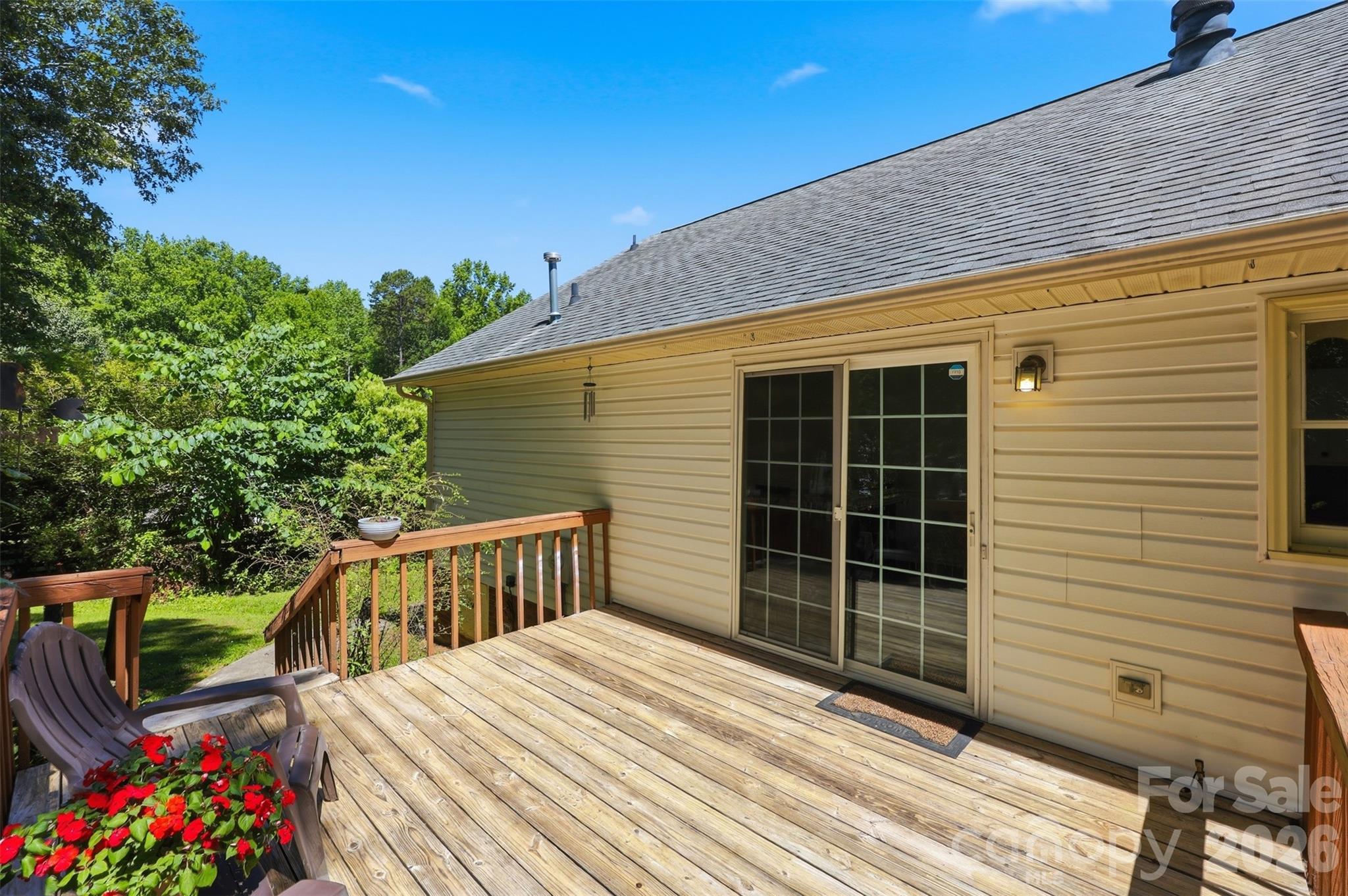 913 Pleasant Ridge Road Fort Mill, SC 29715 - Photo 28 of 40 a view of a deck with wooden floor and fence next to a yard