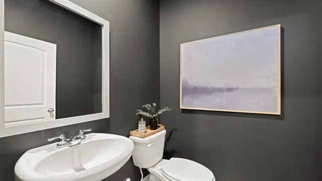 a bedroom with a bed and a lamp