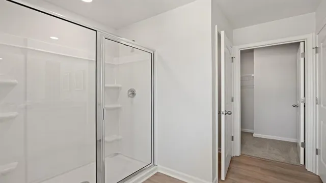 a view of a hallway with closet and a livingroom view
