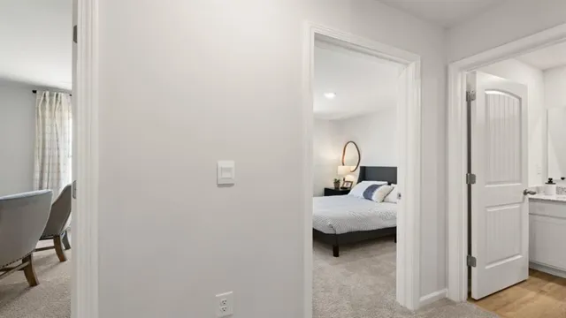 a living room with furniture and a painting