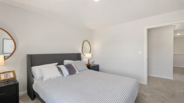 a view of a room with furniture and wooden floor