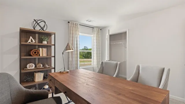 a view of a cafe with sitting area