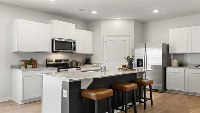 a kitchen with a sink stove and refrigerator