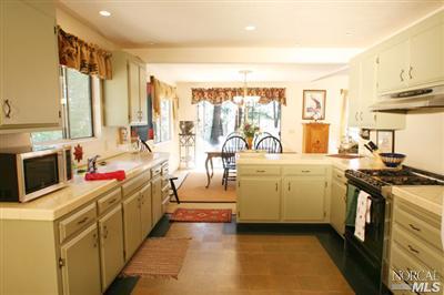 5200 Montecito Avenue Santa Rosa, CA 95404 - Photo 4 of 9 a kitchen that has a lot of cabinets in it and wooden floors