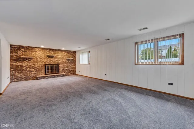 a view of empty room with windows