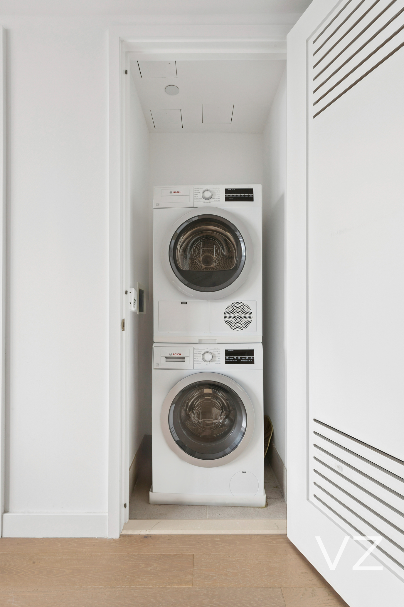 3 Court Square, Unit 5005 Queens, NY 11101 - Photo 6 of 8 a utility room with dryer and washer