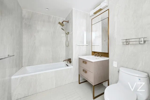 a bathroom with a sink a toilet and a bathtub