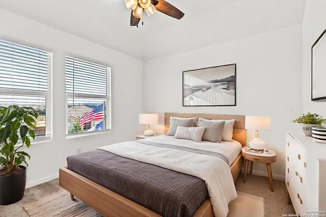 a bedroom with bed and a window