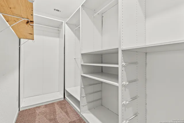 a view of an empty walk in closet