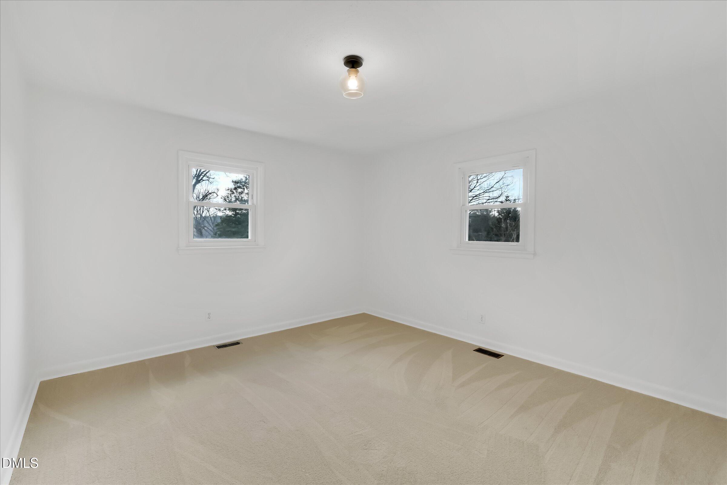 4108 Campbell Road Raleigh, NC 27606 - Photo 16 of 42 an empty room with windows