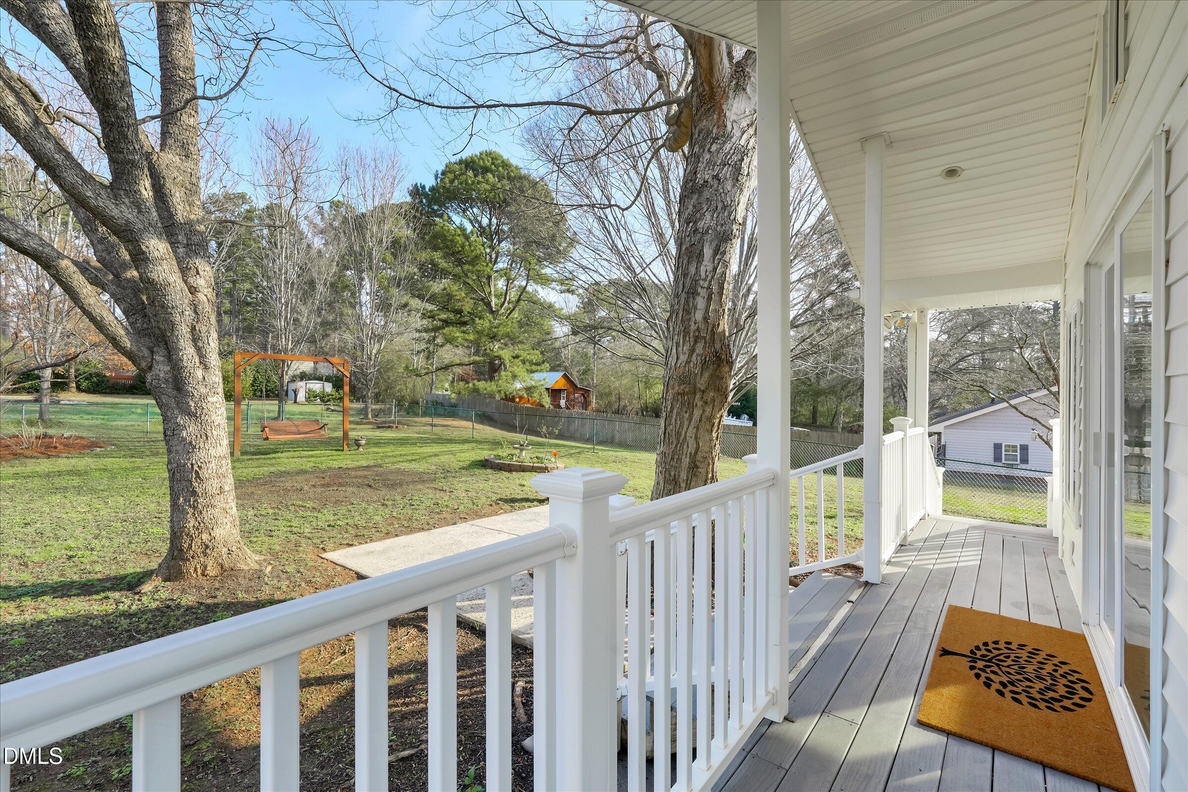 4108 Campbell Road Raleigh, NC 27606 - Photo 22 of 42 a view of a wooden deck and a backyard